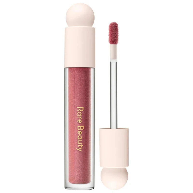 Rare Beauty Soft Pinch Tinted Lip Oil with doe-foot applicator in a moisturizing, glossy rose-pink makeup shade.