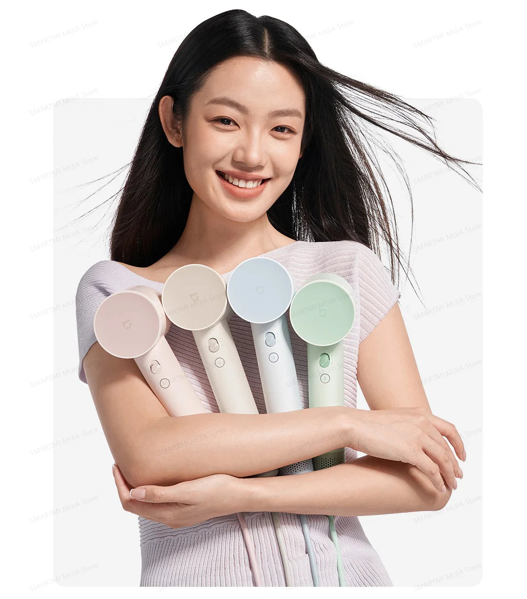 Woman holding 4 colorful MIJIA high-speed hair dryers with 110,000rpm powerful airflow and ergonomic compact design.