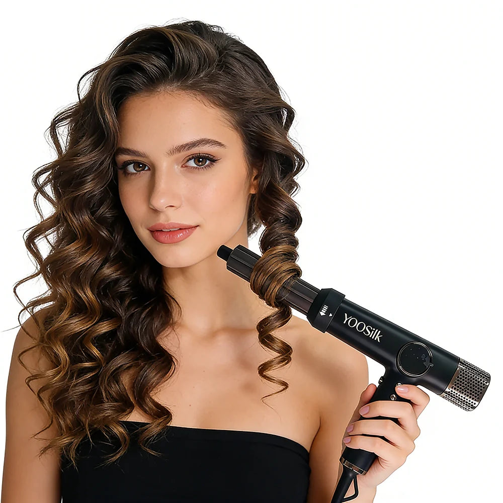 Woman using black 1800W 5-in-1 brushless airwrap hair dryer styler for professional salon-quality curls at home.
