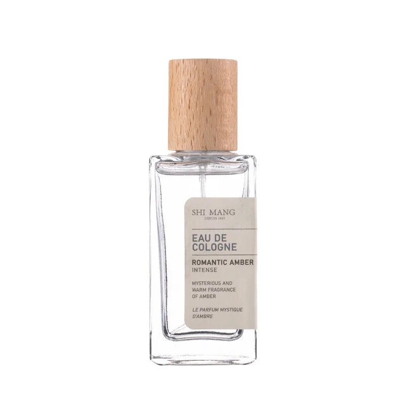 Shi Mang Romantic Amber EDP: Luxury woody amber women's fragrance in a rectangular glass bottle with wooden cap. 50ml.