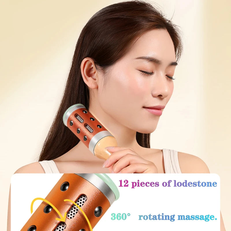 A person uses a cylindrical, copper-colored moxibustion roller massager with 12 embedded lodestones on their neck.