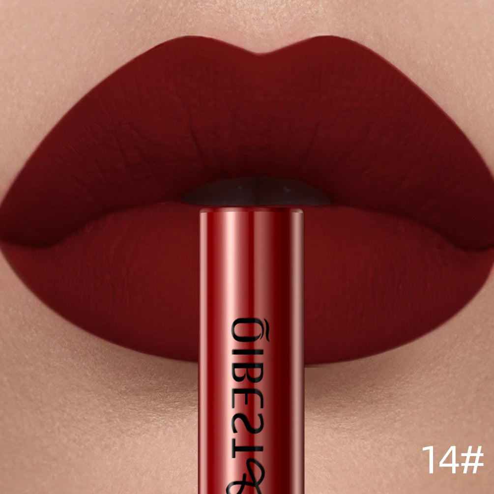 QIBEST long-lasting velvet matte liquid lipstick in a deep sexy red shade worn on lips.