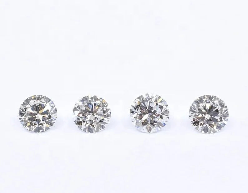 Round brilliant lab-grown diamond set, four white stones viewed from above