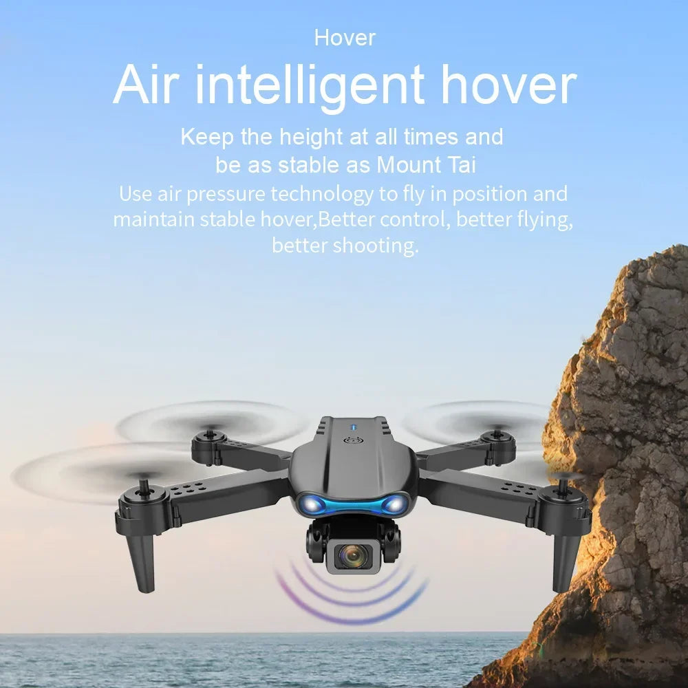 Black quadcopter drone with four propellers, front-facing camera, and blue LED lights for aerial photography.