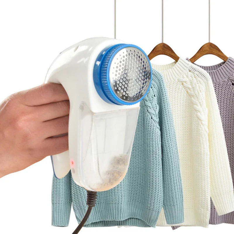 Tidesmit electric lint remover showing the internal shaving blade and removable hair ball collection chamber