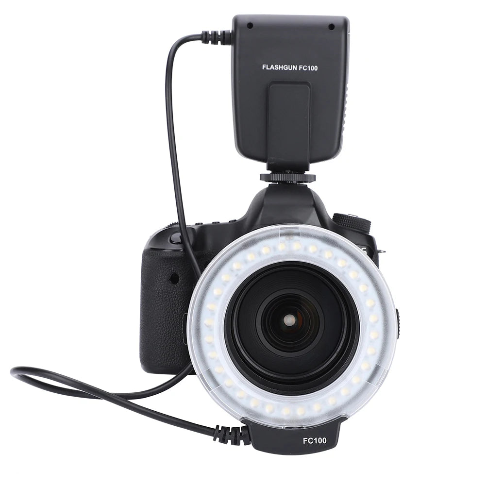 FC100 macro ring flash mounted on a DSLR camera lens, featuring a circular LED light and a connected control unit.