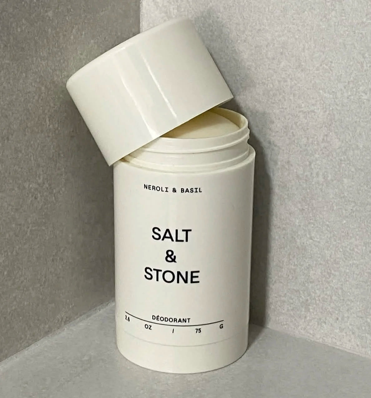 Tidesmit SALT & STONE natural plant-based deodorant stick in Black Rose, Oud, Neroli, and Basil for odor control.