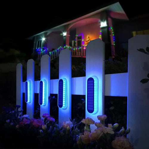 Solar LED deck step lights, blue glow, four-piece pack on a garden walkway