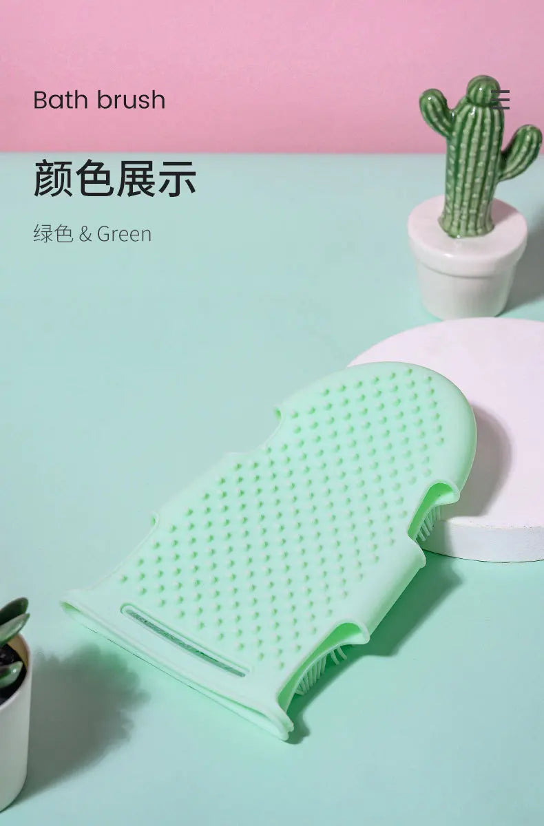 Green silicone pet bath brush glove for gentle massage and skin exfoliation during grooming.