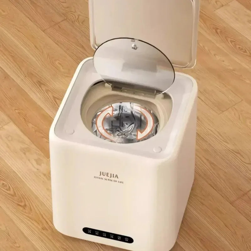 Juejia portable washing machine with open lid and visible drum interior, standing on a light wood floor.