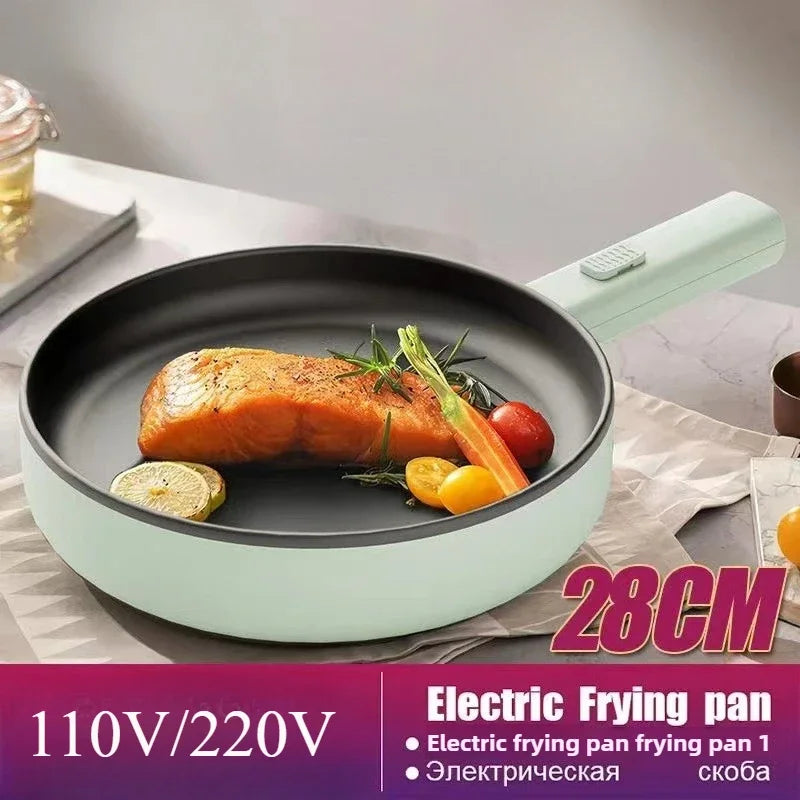 Electric frying pan with mint-green exterior and black nonstick interior, food inside