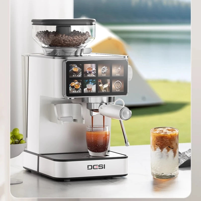 DESI white touchscreen espresso machine with integrated bean hopper, steaming wand, and glass carafe on a table.