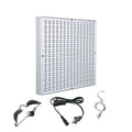 Square silver red light therapy panel with grid of LEDs, power cord, protective goggles, and hanging wire kit.