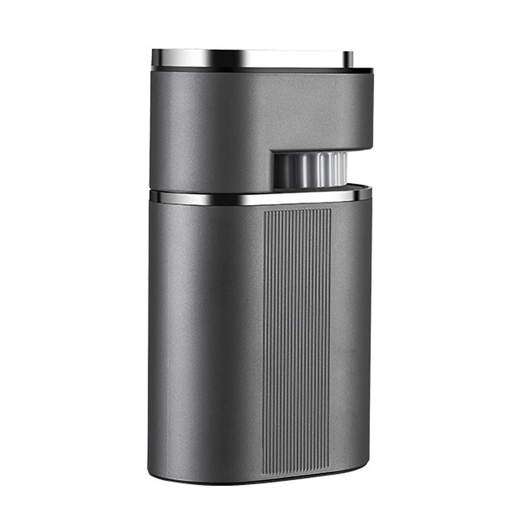 Compact matte gray electric coffee grinder with vertical textured grip and chrome top detail isolated on white.