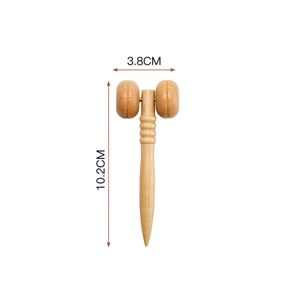 A light-brown wooden T-shaped face massager with two rollers, measuring 3.8cm wide by 10.2cm long.