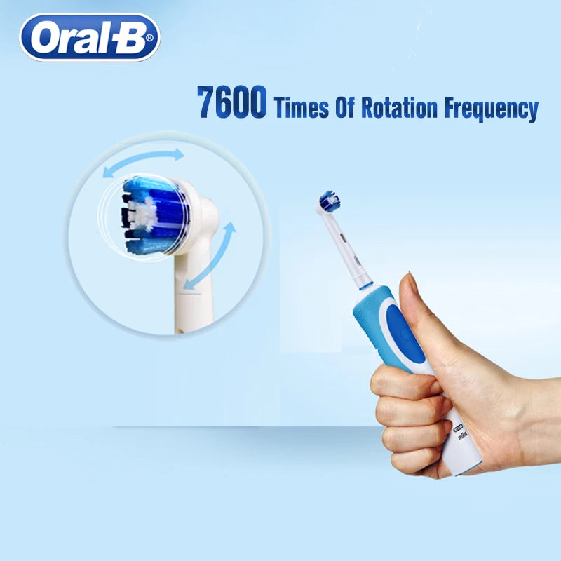 Tidesmit Oral B electric toothbrush showing inductive charging base and extra replacement brush head accessories