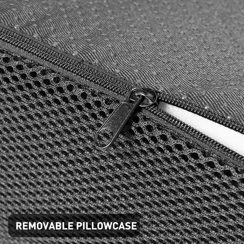 Close-up of black memory foam footstool with breathable mesh cover and zipper for easy removal and cleaning.