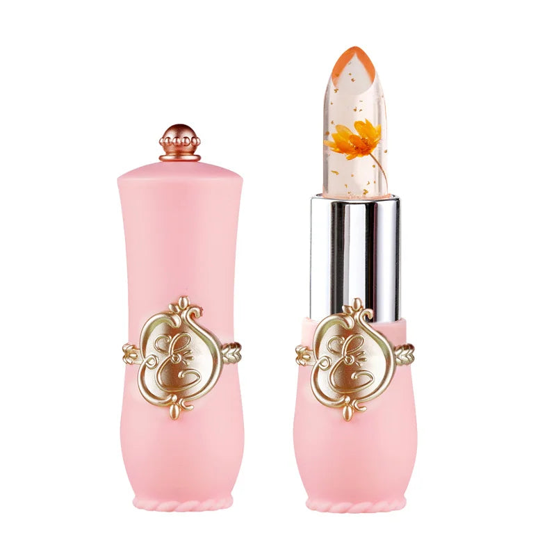 Crystal flower jelly lipstick in pink vintage case with gold flakes and embedded orange flower, moisturizing lip balm.