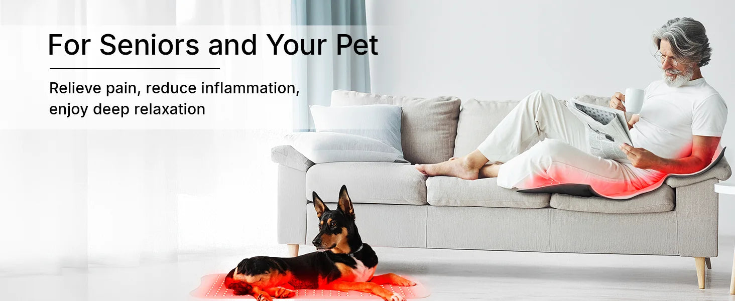 A man sitting on a sofa and a dog both lying on flexible red light therapy mats emitting a soft red glow.