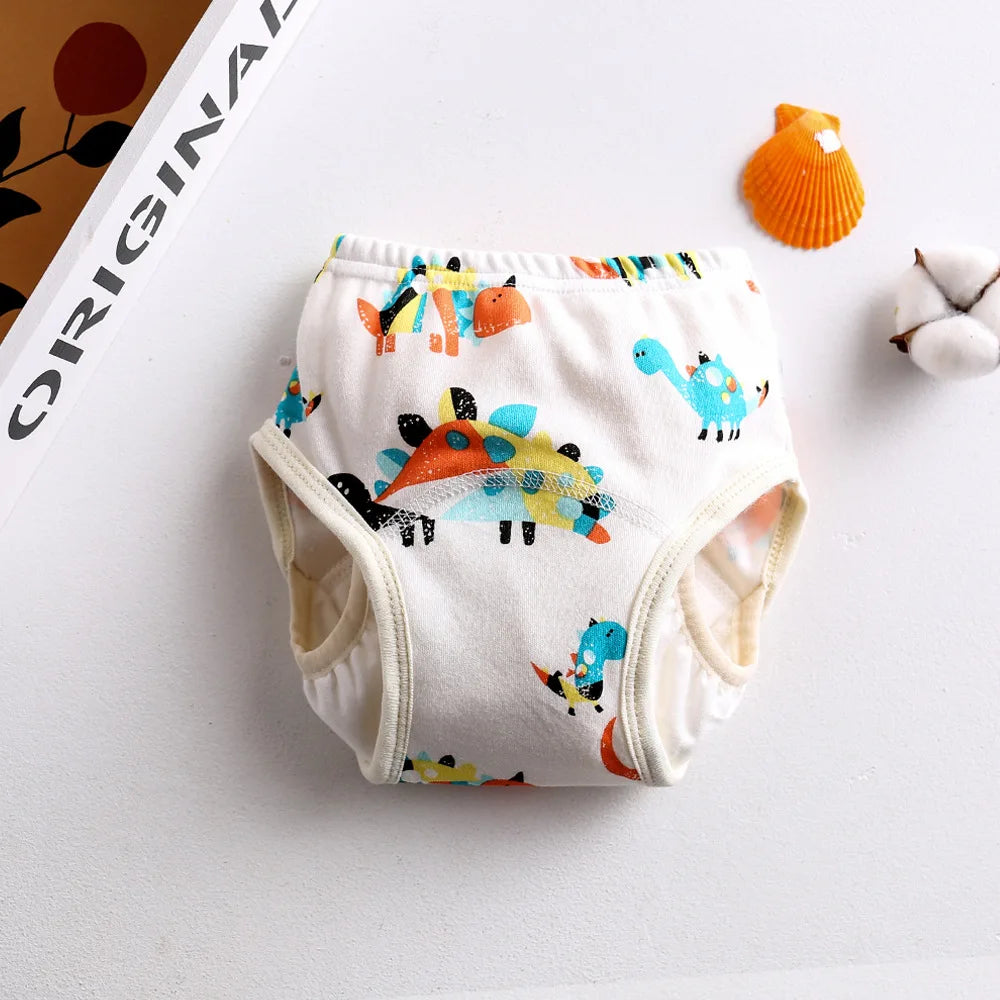 Baby training diaper with colorful dinosaur print, soft cotton material for toddler potty training.