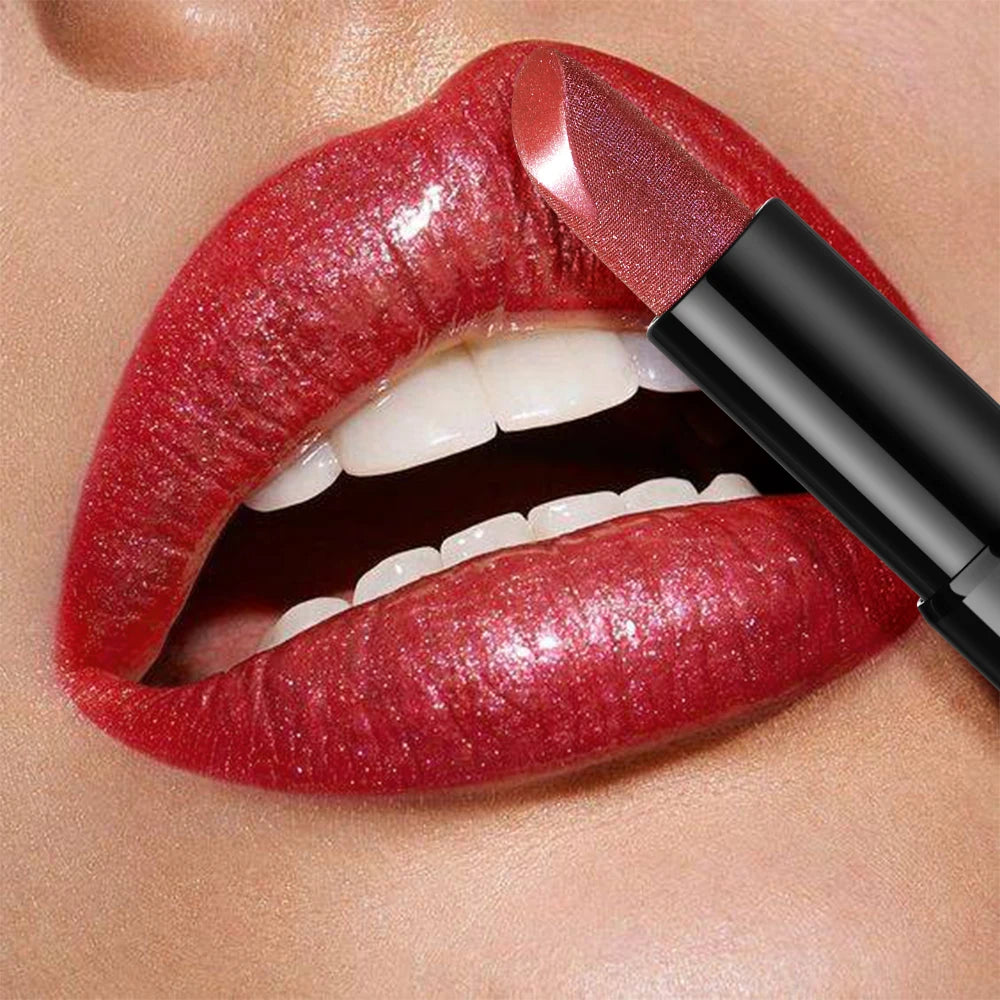 Pearly metallic red lipstick with glitter shimmer finish for high color payoff and a smooth, creamy texture.