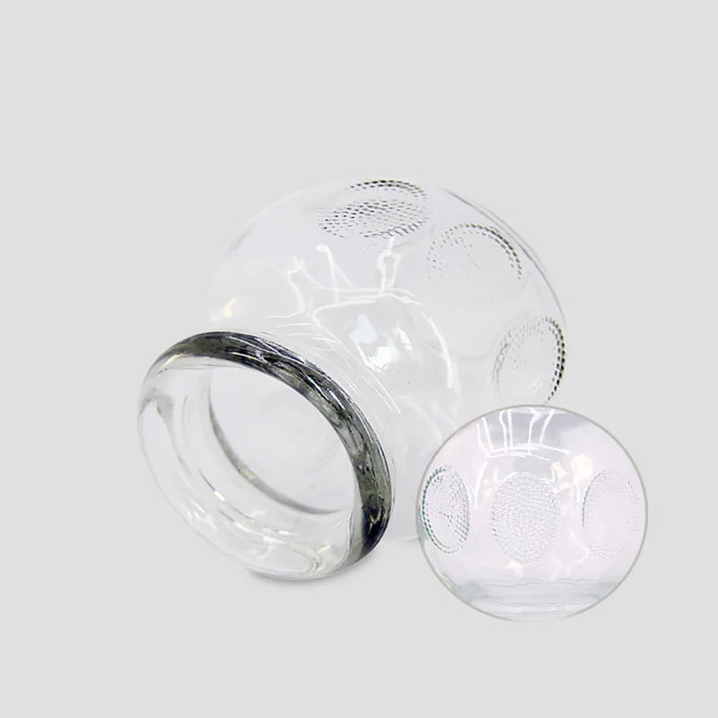 Extra thick clear glass cupping therapy cups with textured grip for professional or home fire cupping massage.