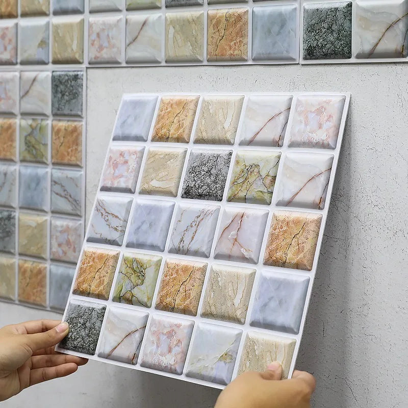 Marble-look peel-and-stick tile sample sheet with mixed white, gray, and gold squares