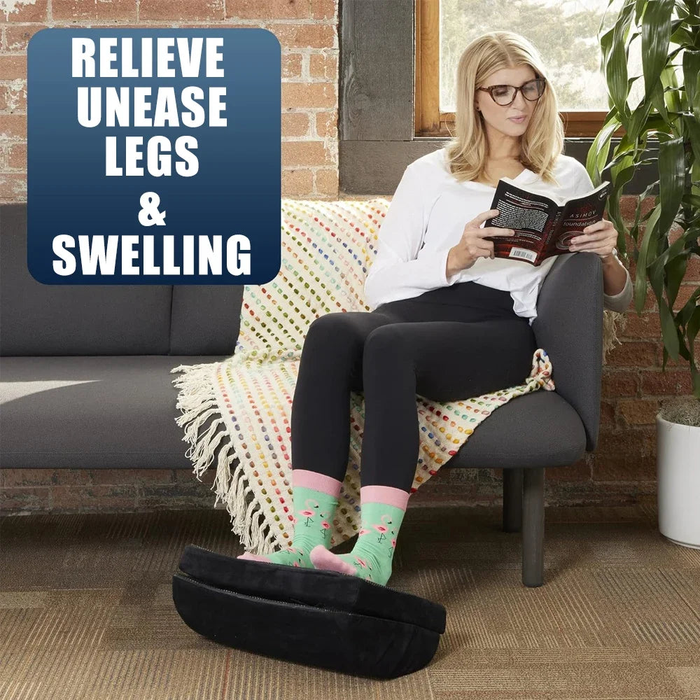 Woman resting feet on a black, ergonomic, adjustable 2in1 foam under desk footrest to relieve leg pain and swelling.
