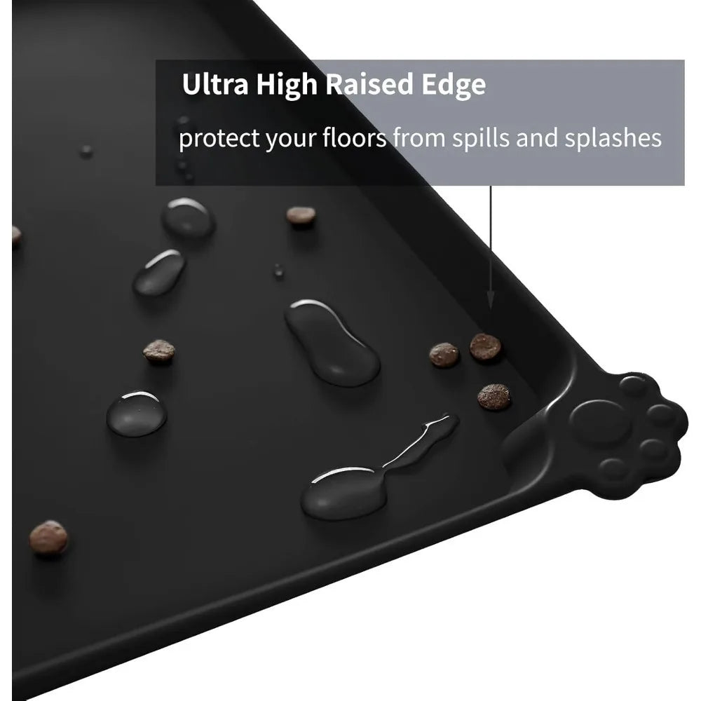 Waterproof black silicone pet feeding mat with raised edges to catch food spills and protect floors for cats and dogs.