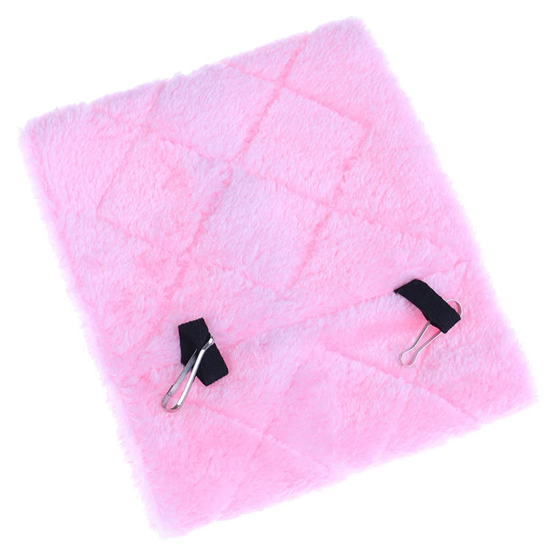 Soft pink plush hanging hammock for hamsters, birds, and small pets to provide a warm, cozy winter nest in their cage.