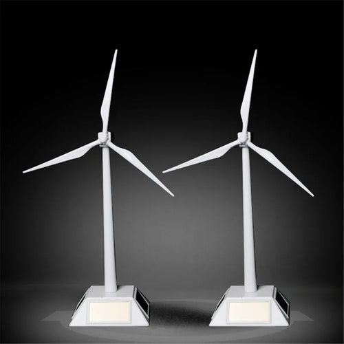Two white wind turbine desktop models with solar-panel bases set against a dark background.