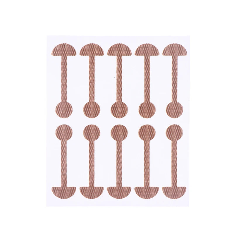 Invisible skin-toned nose wing shrinking stickers, narrow nose lifting strips on a backing sheet for face contouring.