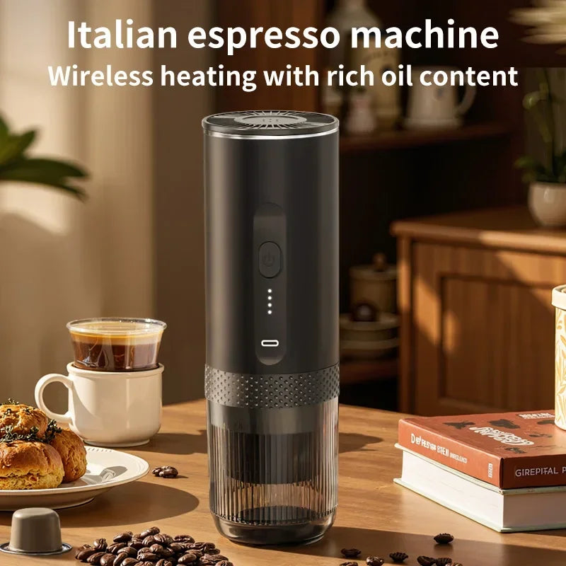 Portable matte black wireless Italian espresso maker with LED battery indicator and clear base on a table.
