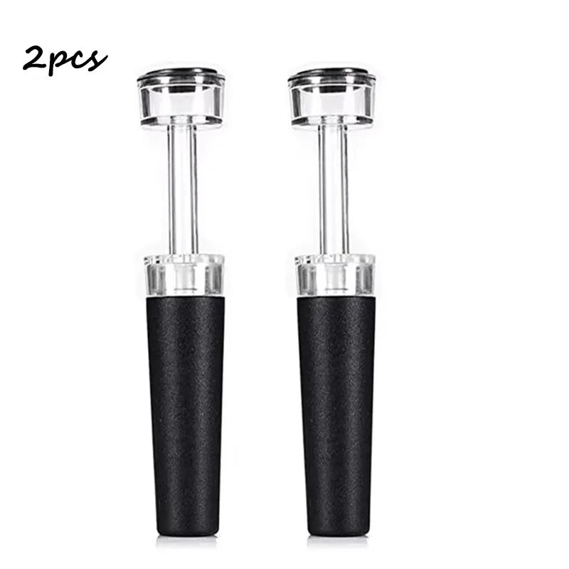 2-piece vacuum wine bottle stopper set with black textured silicone bodies and clear pump tops
