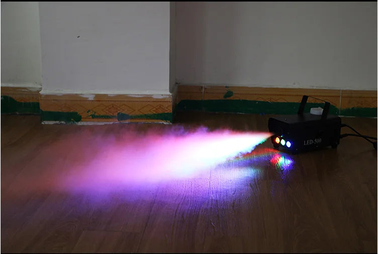 LED-500 fog machine producing purple and blue light haze on a floor