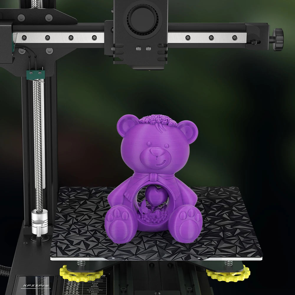 Purple 3D printed teddy bear on a 235x235mm magnetic PEI spring steel build plate for Ender 3 series printers.