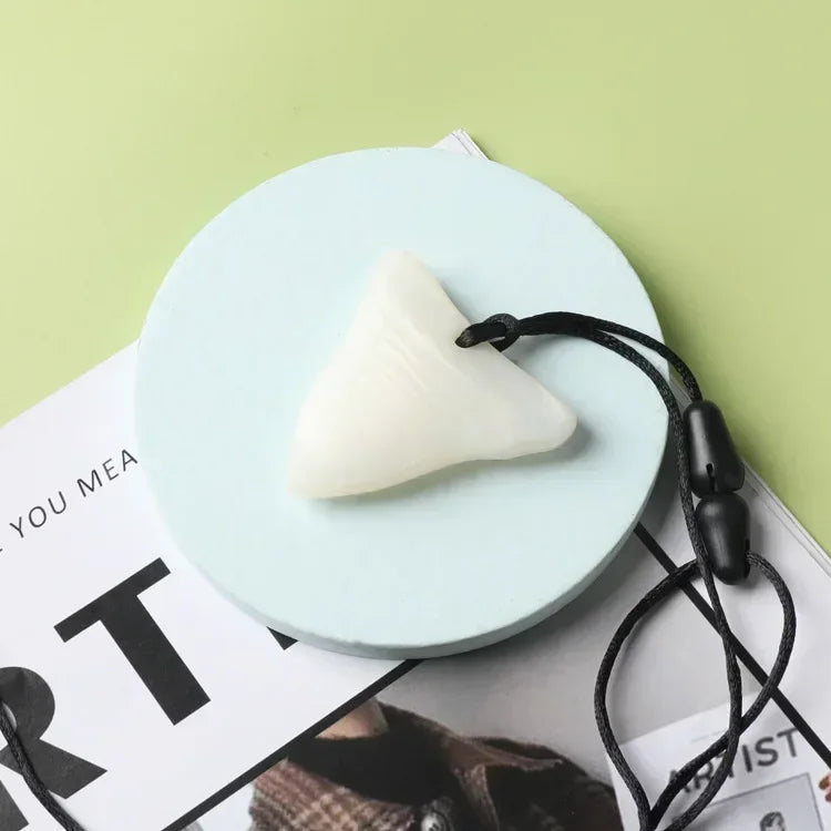 White silicone teething toy necklace for baby teething relief.