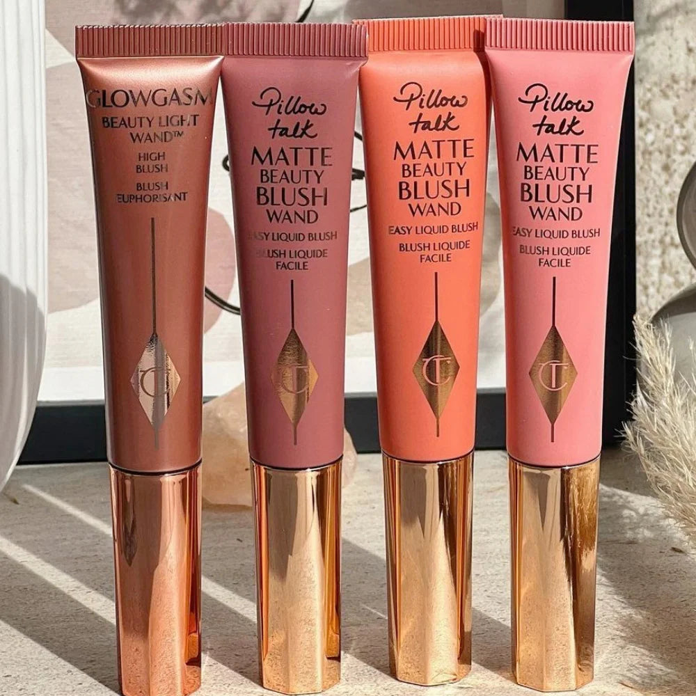 Charlotte Tilbury liquid blush wands in metallic tubes, featuring matte and glowy pink, peach, and coral blush shades.
