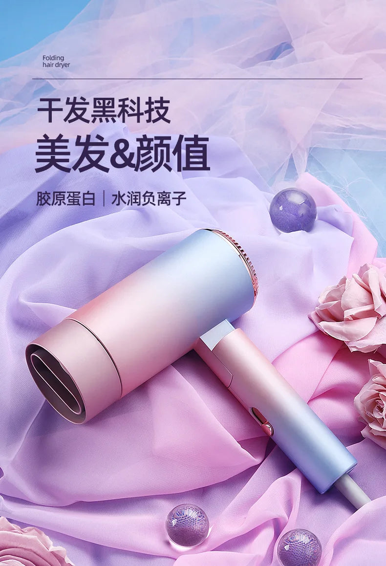Foldable blue-pink gradient ionic hair dryer with nozzle attachment for quick, damage-free, salon-style drying.