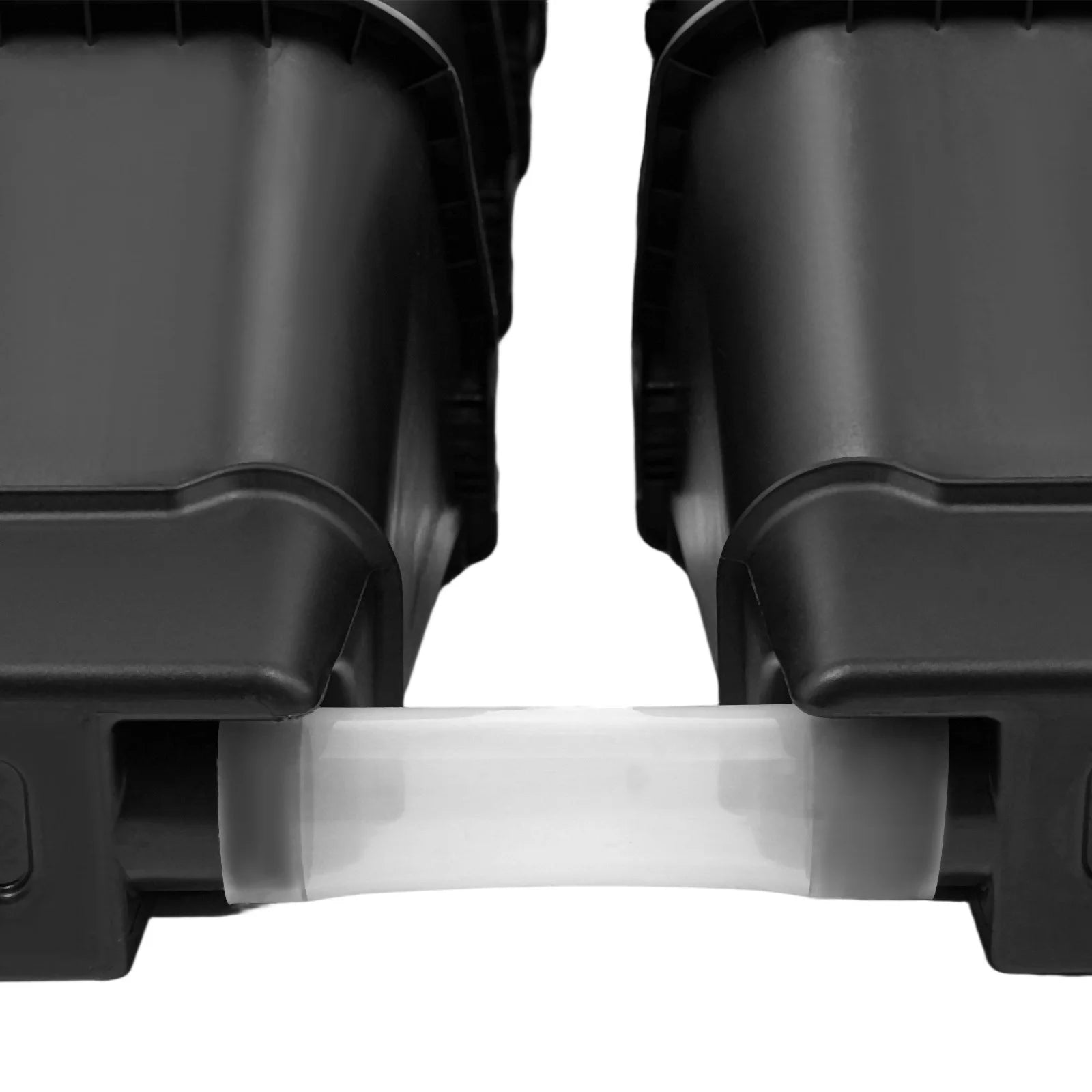 Close-up of black planter pockets with white spacer tab between units