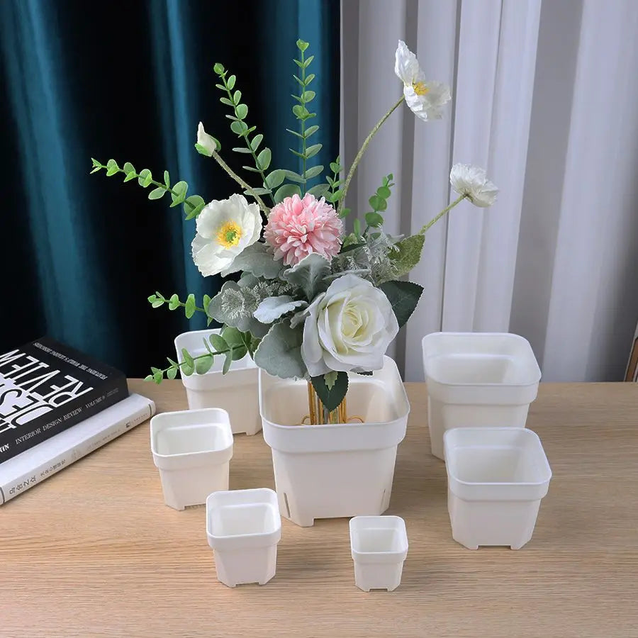 Set of small white square succulent planters in multiple sizes