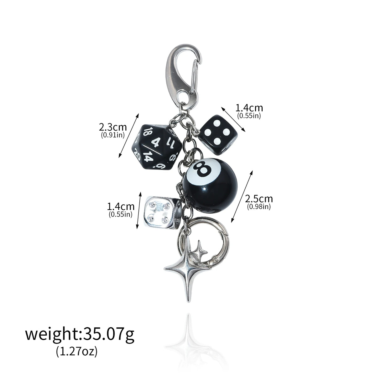Silver-tone keychain with black 8-ball charm, black dice, white die, star pendant