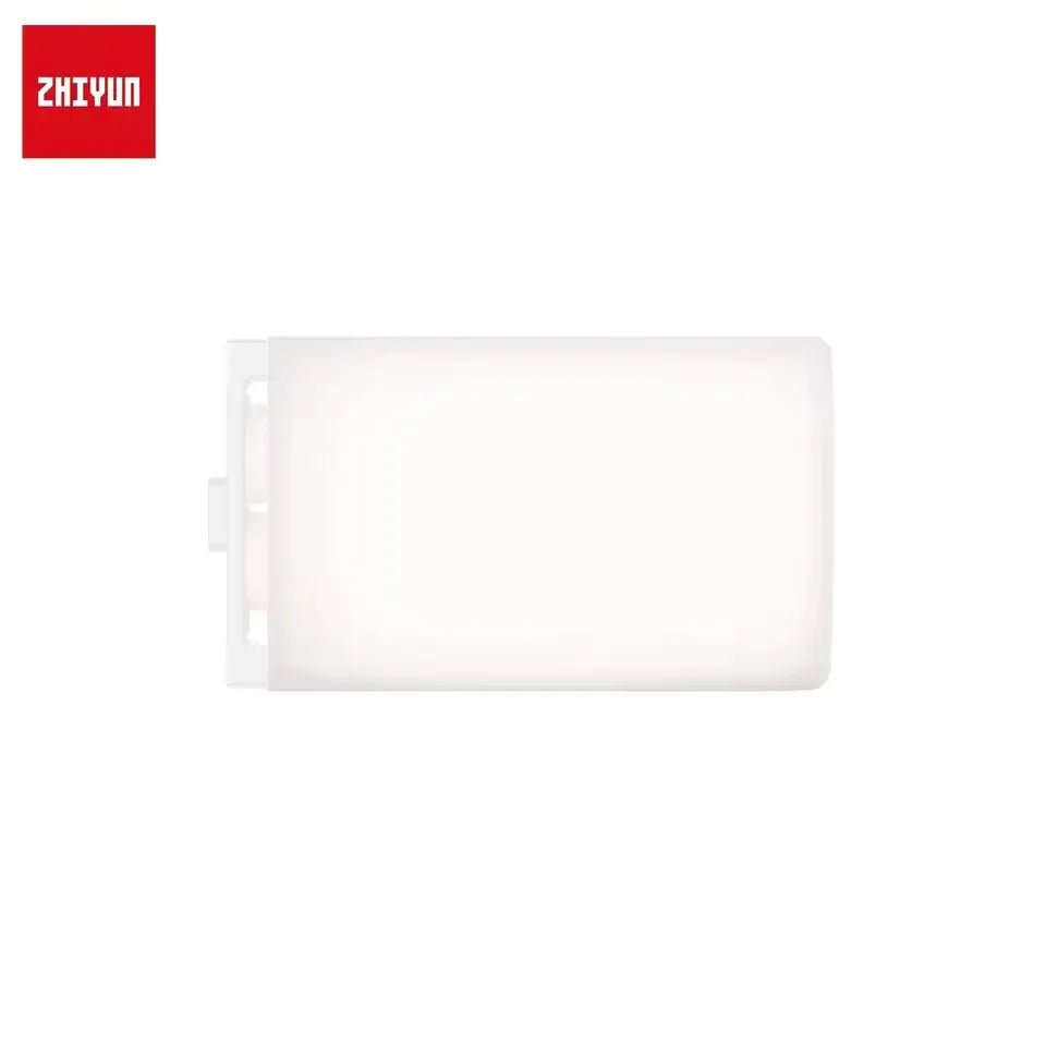 Rectangular white silicone light diffuser attachment for a portable LED panel light.