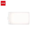 Rectangular white silicone light diffuser attachment for a portable LED panel light.