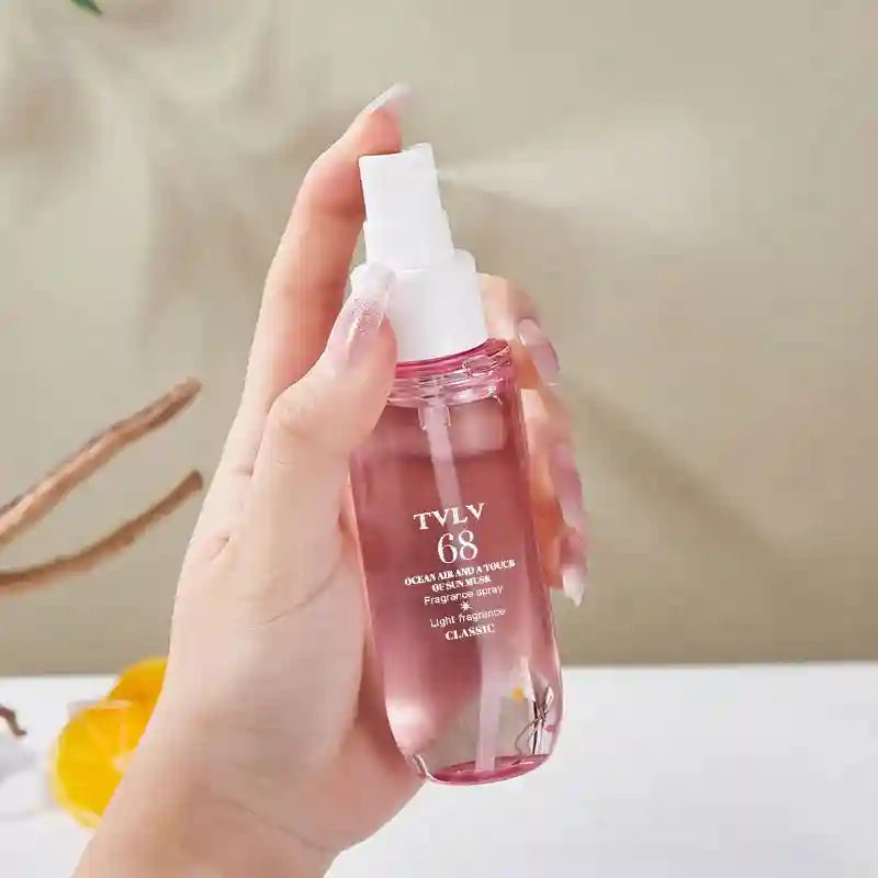 TVLV 68 Brazilian perfume spray, alcohol-free, ocean air & sun musk notes in a chic pink pump bottle for parties.