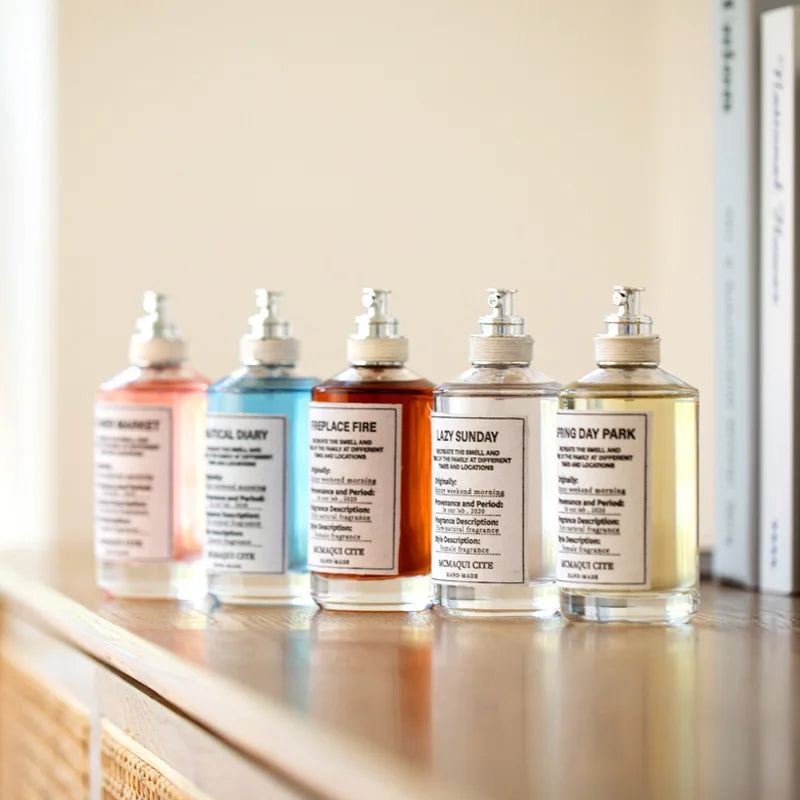 100ml Maqui Cite unisex perfume set, round glass bottles, fresh sandalwood & musk EDT, lasting luxury fragrance.