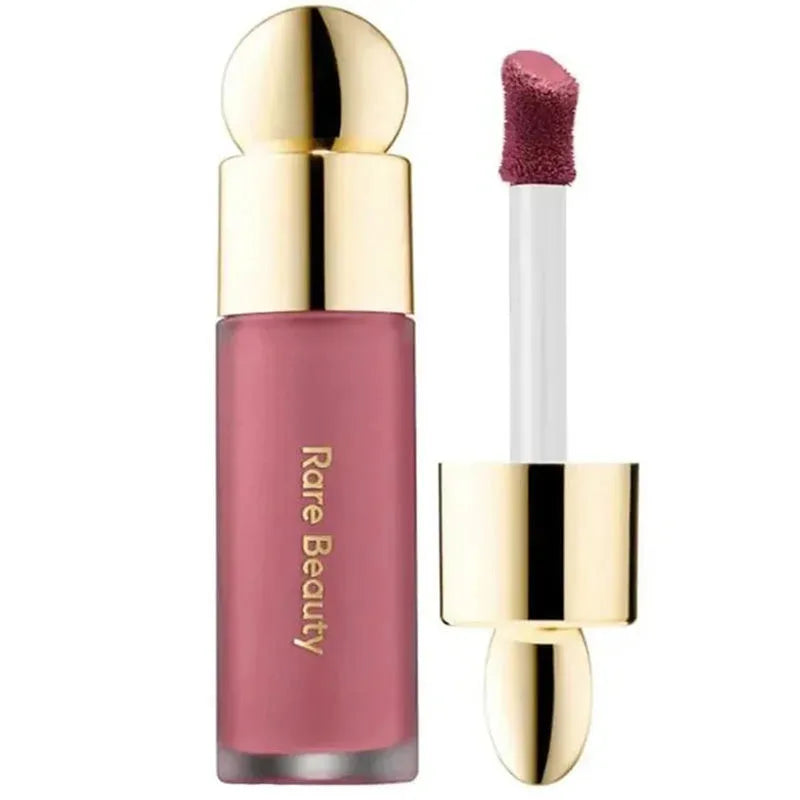 Rare Beauty rose liquid blush stick for lips and cheeks with gold cap and soft doe-foot applicator, long-lasting color.