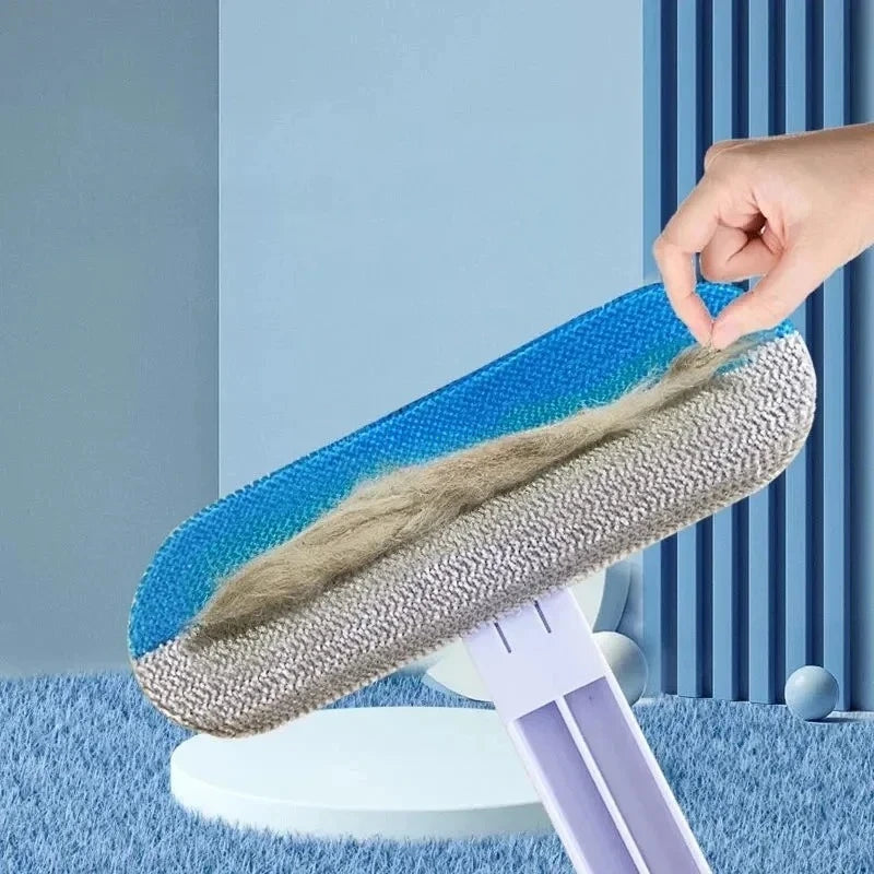 Blue and grey manual pet hair remover brush effectively cleaning fur from carpet, bed, and furniture.