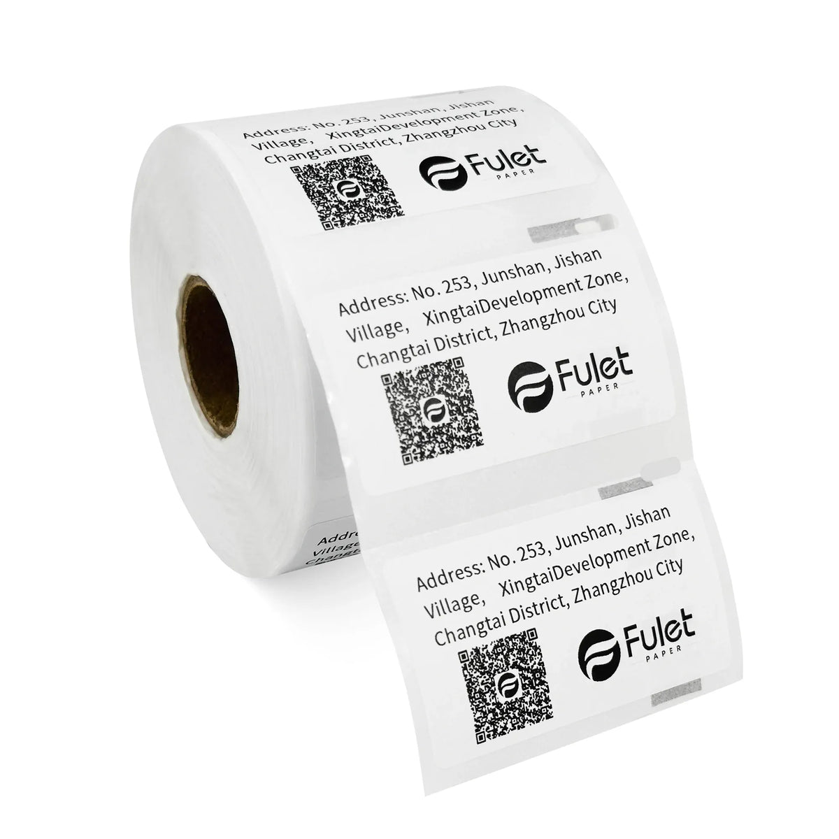 White barcode label roll angled, showing multiple printed address labels with QR codes.