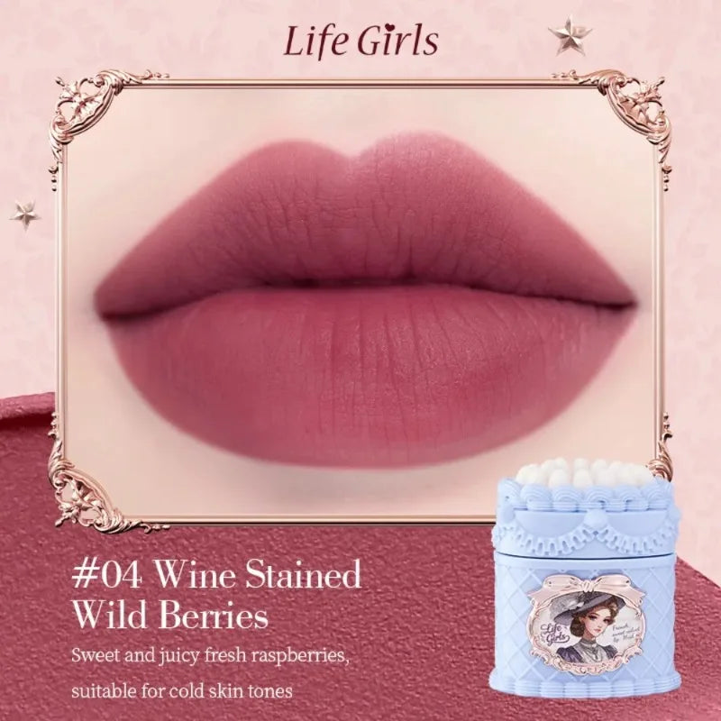Vintage strawberry cake matte lip mud in Wine Stained Wild Berries, featuring a soft-focus velvet mousse finish.